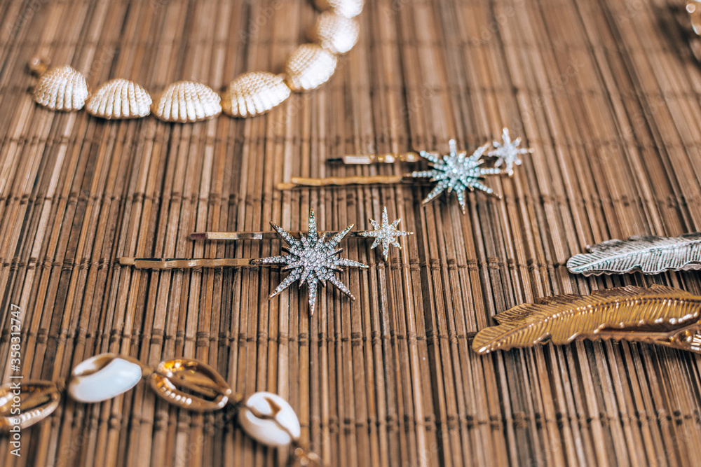 Fototapeta premium Pearl, Seashell, Beads Accessories on Natural Bamboo Background