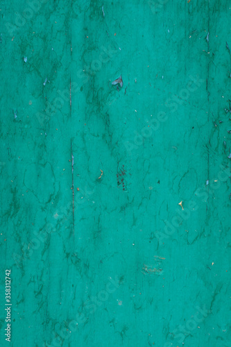 green painted board. wooden background