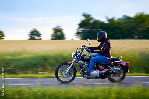 Tablou canvas Unidentified man driving a chopper motorcycle