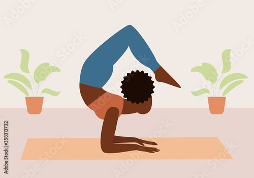 Young woman practicing yoga at home during the coronavirus pandemic. Pose of yoga.