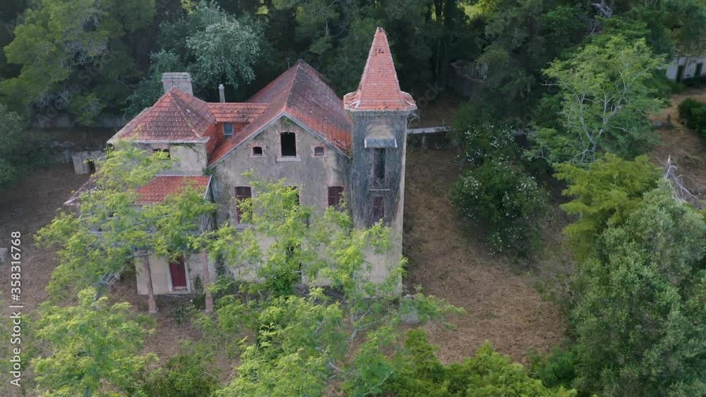 Backwards aerial shot of an old abandoned manor Backwards aerial shot of an old abandoned manor