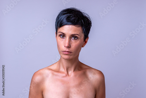 Serious attractive mature woman with dark hair