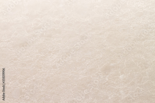 Transparent soap foam bubbles beige color macro