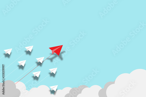 Red paper plane flying disrupt with white paper plane on blue background. Lift and business creativity new idea to discovery innovation technology.