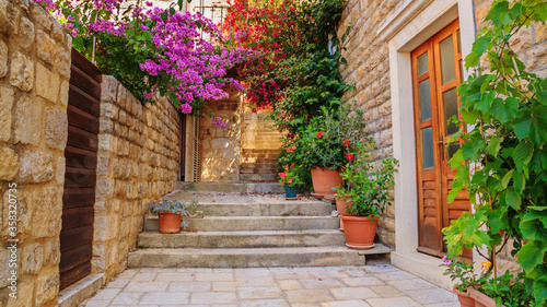Mediterranean summer cityscape - view of a medieval street with stairs in the Old Town of Hvar, on the island of Hvar, the Adriatic coast of Croatia