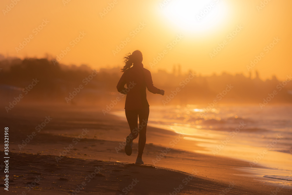 Beachside Fitness: Girl's Morning Jog in Silhouette