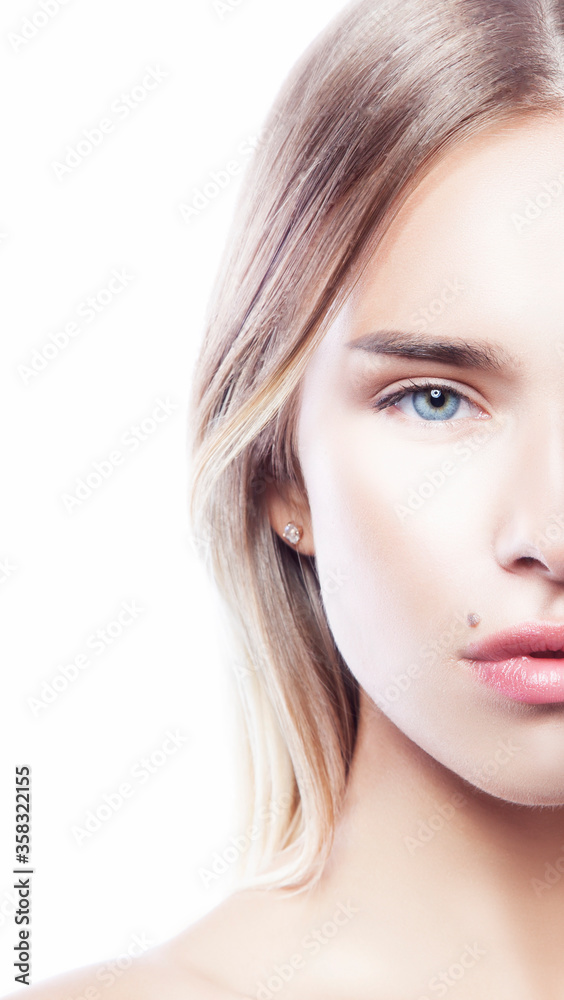 Beautiful face of young caucasian girl with natural make-up, perfect skin and blue eyes isolated on white background. Studio portrait Beautiful face of young caucasian girl with natural make-up, perfect skin and blue eyes isolated on white background. Studio portrait