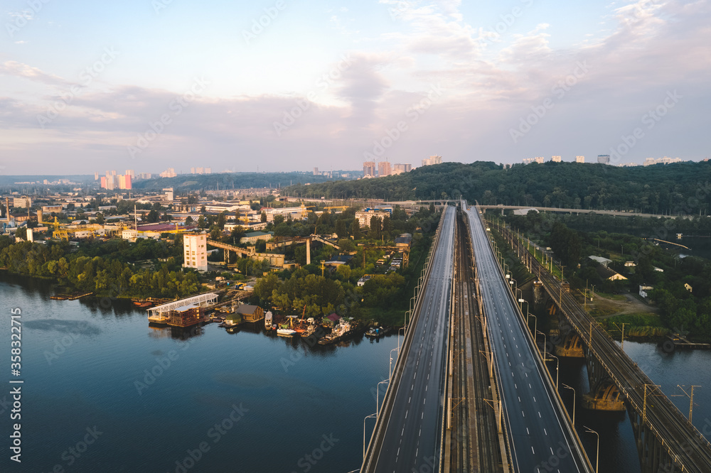 A bridge with a road through the River Dayspro near the industrial production quarter in Kiev. Empty highway with markings on the bridge.