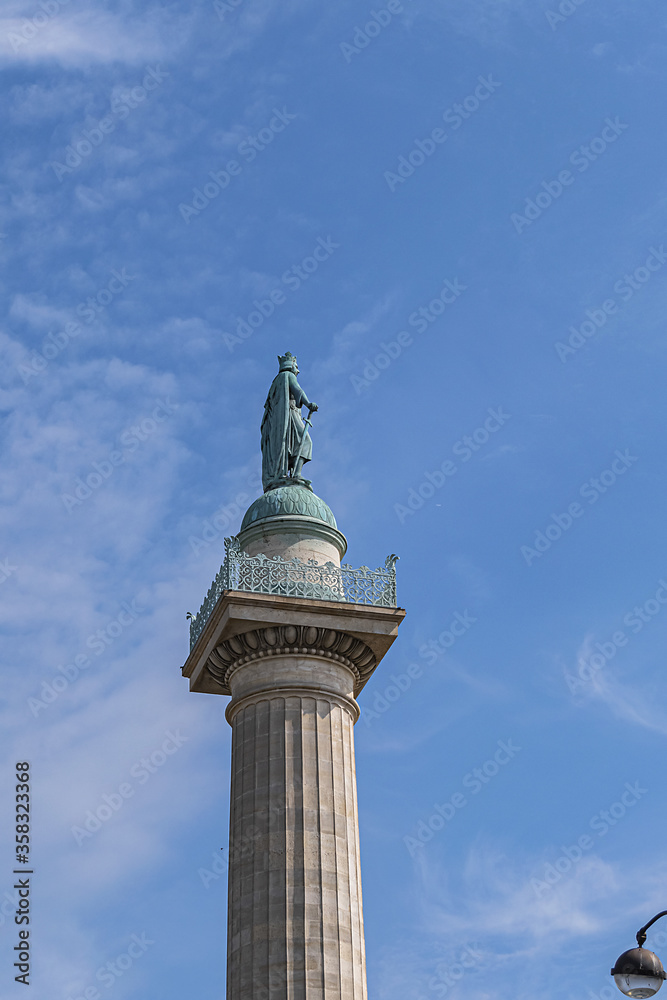 The Throne Barrier and two columns were constructed as part of Wall of Farmers General back in 1700s by Place de la Nation. Saint-Louis statue on the north column. Paris, France.