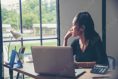Stressed businesswoman Frustrated and upset in business pressure and overworked at home office.Adult woman working on laptop,feeling tired and headache.Stressed and Frustrated concept.