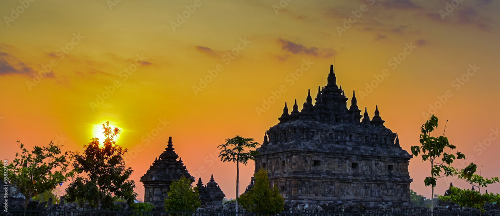 Beautiful Plaosan Buddha temple silhouette view in sunset golden hours sky
