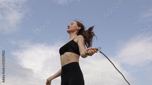 Young woman exercising in the city park