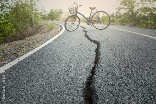 This is picture of broken or split asphalt road with selective focus of broken line
