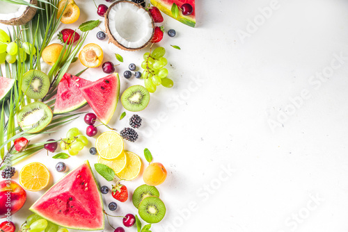 Assorted different summer tropical fresh raw fruits and berries. Clean eating, healthy lifestyle, diet and vitamin concept. 