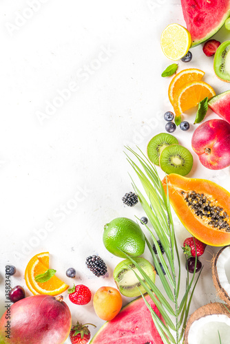 Fototapeta Naklejka Na Ścianę i Meble -  Assorted different summer tropical fresh raw fruits and berries. Clean eating, healthy lifestyle, diet and vitamin concept. 