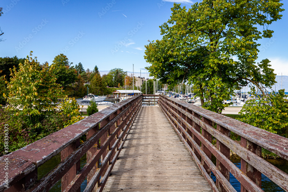 Pedestrian Wooden Bridge over Beaver River Mouth, Thornbury harbor, Collingwood, Ontario, Canada