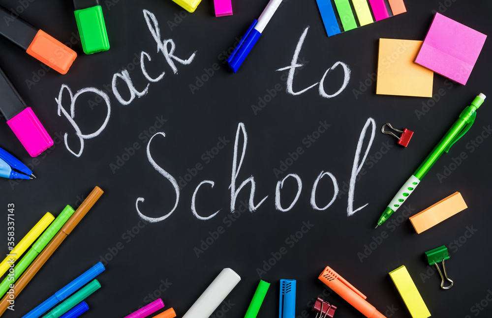 Back to school is written in white chalk Back to school is written in white chalk