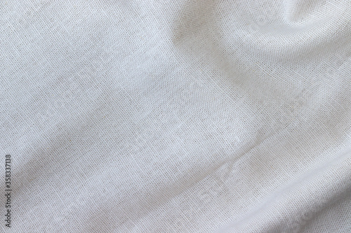 Soft natural linen texture. Crumpled fabric background. Selective focus. Closeup view