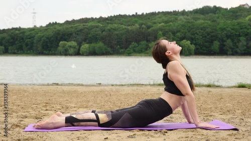 Young woman doing yoga exercise and stretching