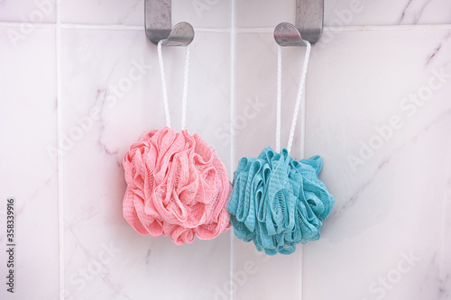 Fotografie Pink and blue shower scrubbers