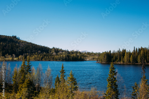 beautiful blue lake in a forest in Sweden