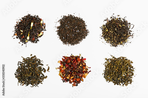 different types of tea scattered on a light gray background. tea shop concept. tea party concept. concept of different tastes and choices. top view, flat lay.