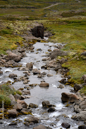 Little waterfall Klifbrekkufossar in Mjoifjordur, Iceland