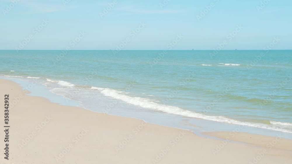 Sea Beach and blue sky bright background. Fresh and sunny day with tropical seascape beach of Thailand with wave crashing on sandy shore. Sea Beach and blue sky bright background. Fresh and sunny day with tropical seascape beach of Thailand with wave crashing on sandy shore.