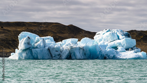 Ice floating in Jokulsarlon, a large glacial lake in southeast Iceland, Vatnajokull National Park photo