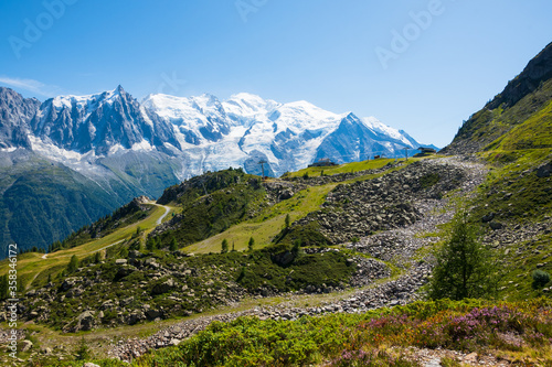 Beautiful view of Aiguille du Midi and Mont Blanc massif within the French Alps in summer from Plan Praz. France tourism background. Hiking concept. photo