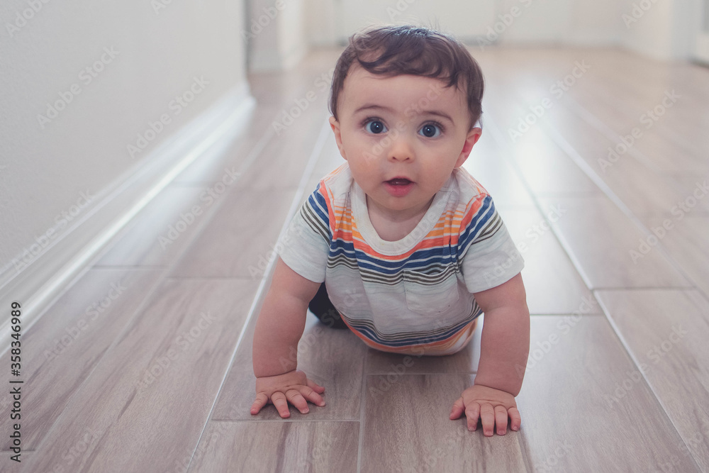 Baby playing crawling on the floor learning to crawl Baby playing crawling on the floor learning to crawl