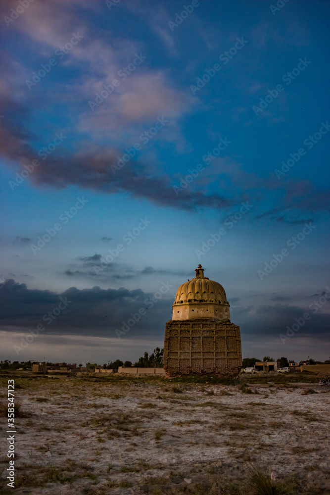 Obraz premium Old historic tomb in a graveyard in rural areas of Sindh Pakistan.