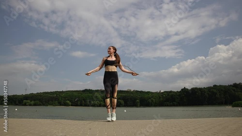 Young woman jumping on the rope