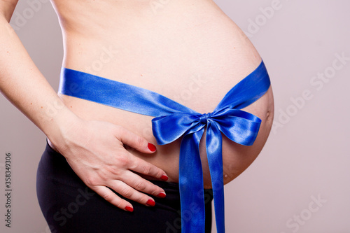 Wallpaper Mural pregnant belly with blue ribbon Torontodigital.ca