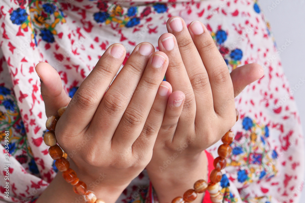 Close up of of muslim women hands praying 