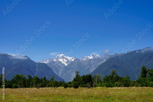 Landscape with Mt. Cook and Mt. Tasman in a blue sky - late summer.