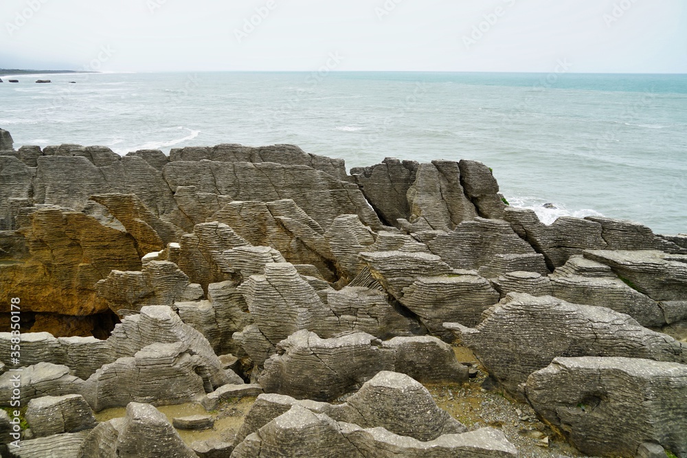 Pancake rocks and ocean grey sky. Pancake rocks and ocean grey sky.