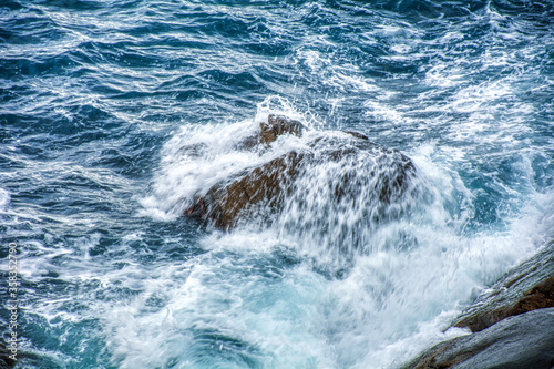 waves crashing on rocks © Vasil