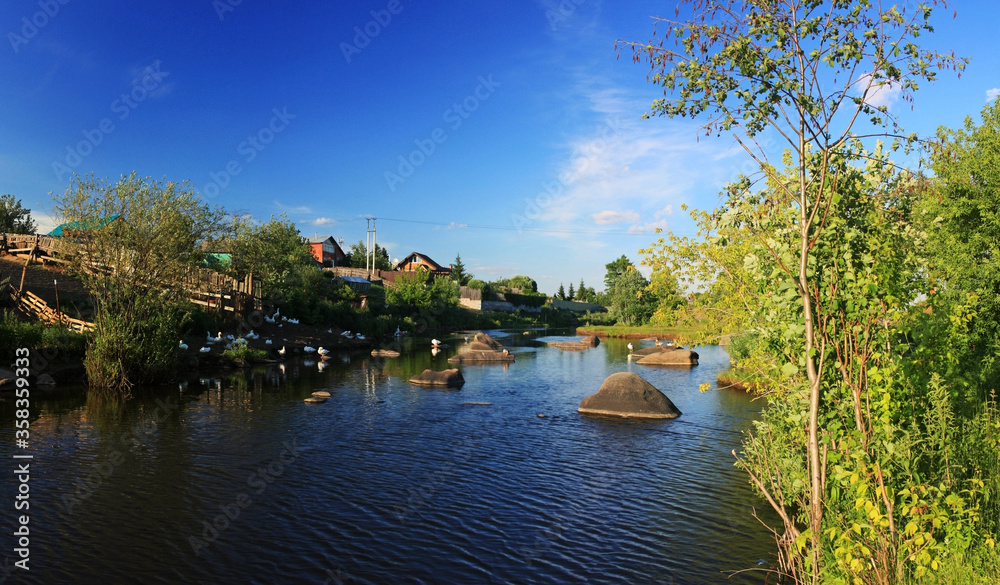 Fototapeta premium Village on the banks of the river