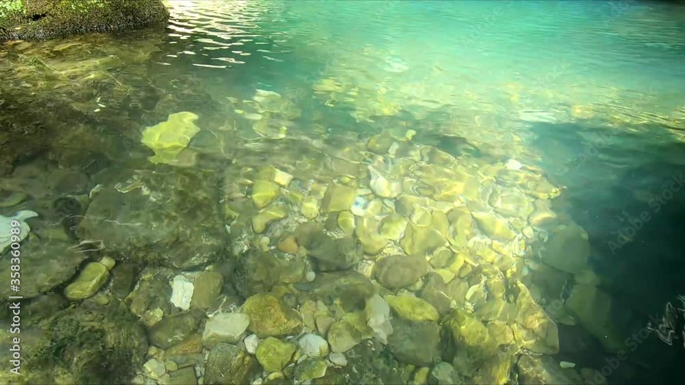Mountain stream. A stream of clear water flows over the stones. Waterfall in the rainforest. Mountain stream. A stream of clear water flows over the stones. Waterfall in the rainforest.