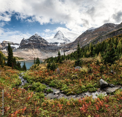 Mount Assiniboine with Lake Magog on Autumn forest at provincial park © Mumemories