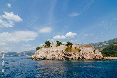 Landscape in Montenegro. View from the water on the fortress wall of the old city, located on a steep cliff. photo