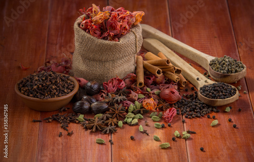 Fototapeta Naklejka Na Ścianę i Meble -  Spices with wooden background