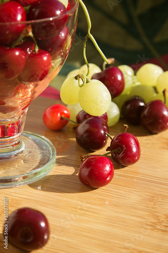 various fresh natural organic berries: cherry and grape