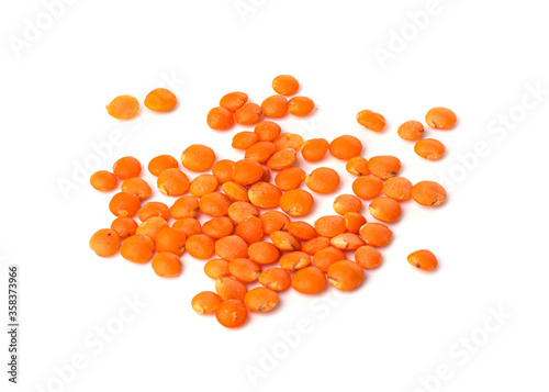 A pile of raw red lentils isolated on a white background. useful product. healthy lifestyle