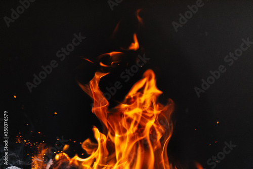 burning firewood in a barbecue or barbecue. photo of a fire with flames in the street