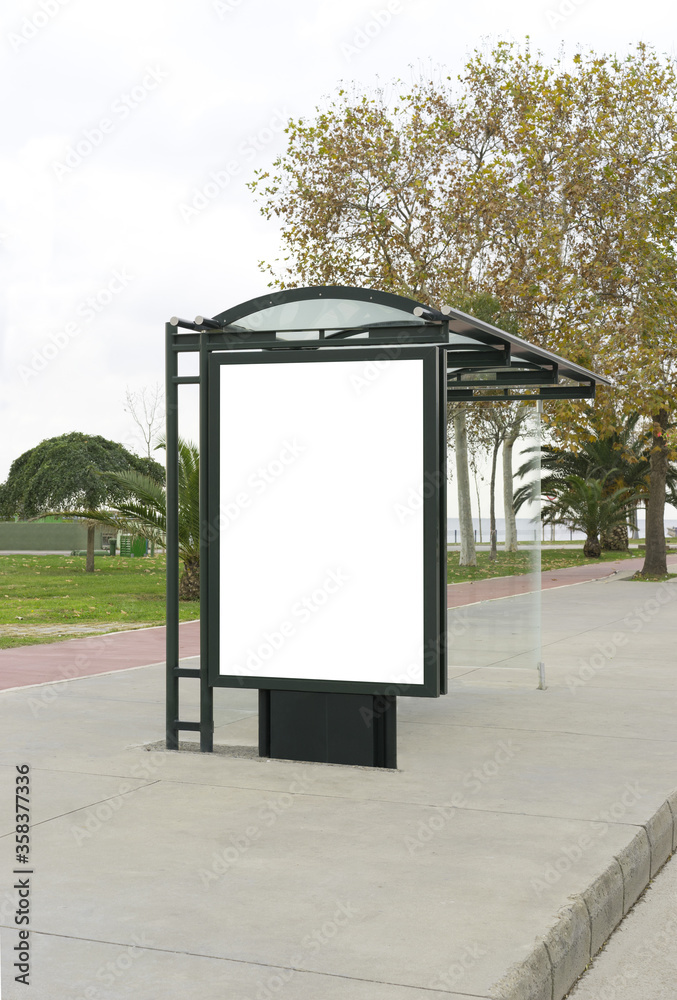 Blank white mockup of bus stop billboard in empty Caddebostan street.