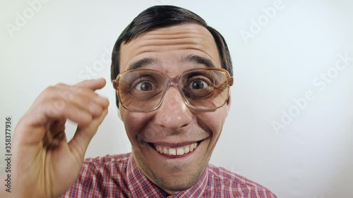 Old-fashioned funny man puts on a glasses
