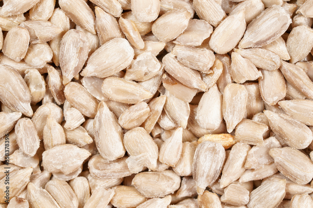 White peeled sunflower seeds, closeup detail from above White peeled sunflower seeds, closeup detail from above