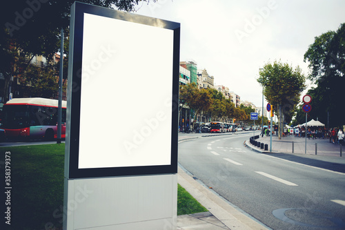 Blank billboard with copy space for your text message or promotional content  empty public information board in the big town  advertising mock up banner in metropolitan city on roadside